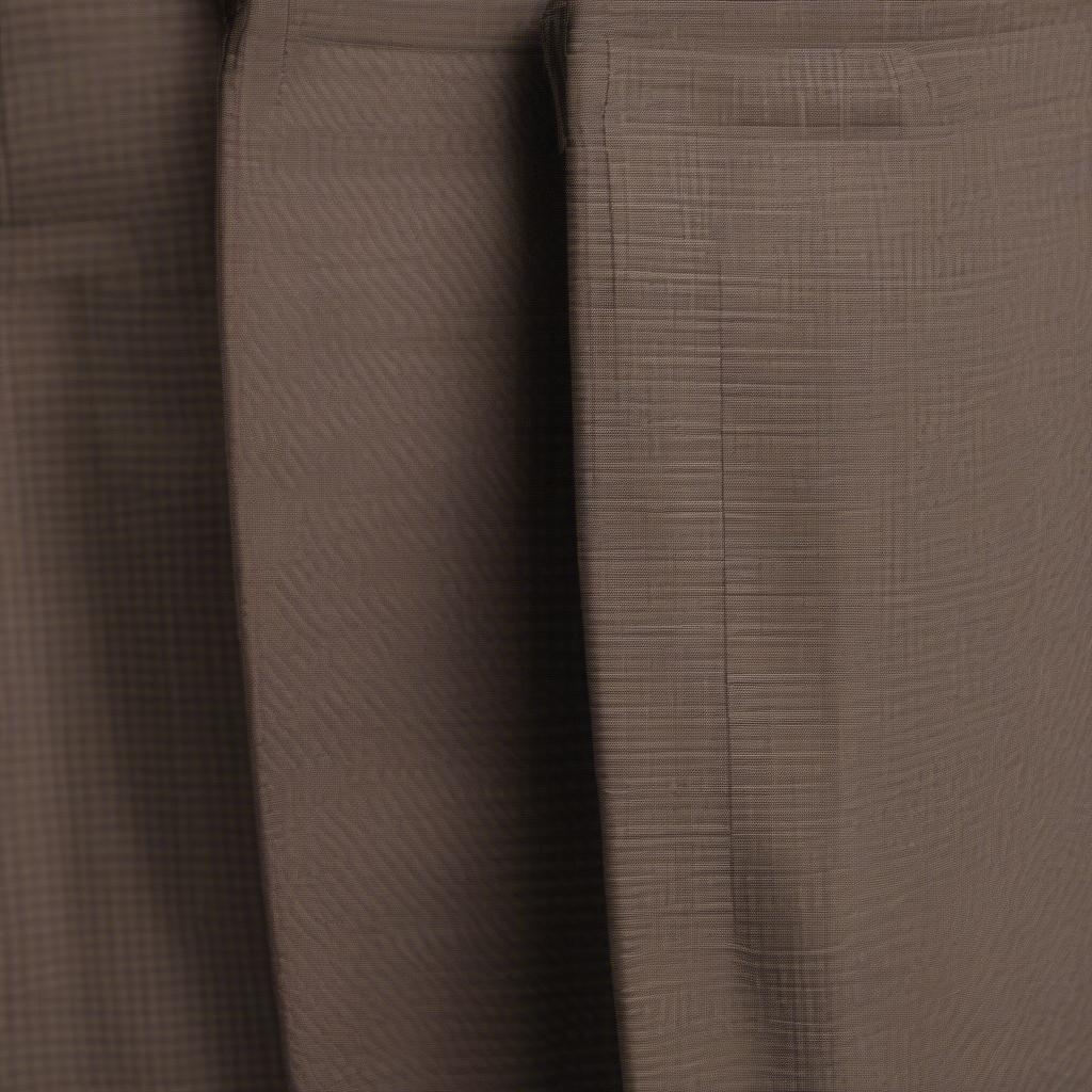 Proper care and storage of basket weave dress pants: folding and hanging techniques.