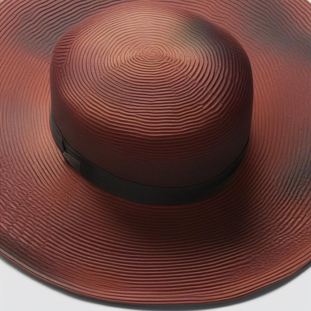 Close-up view of the Calvin Klein Ombré Weave Sun Hat showing the intricate weave and color gradient