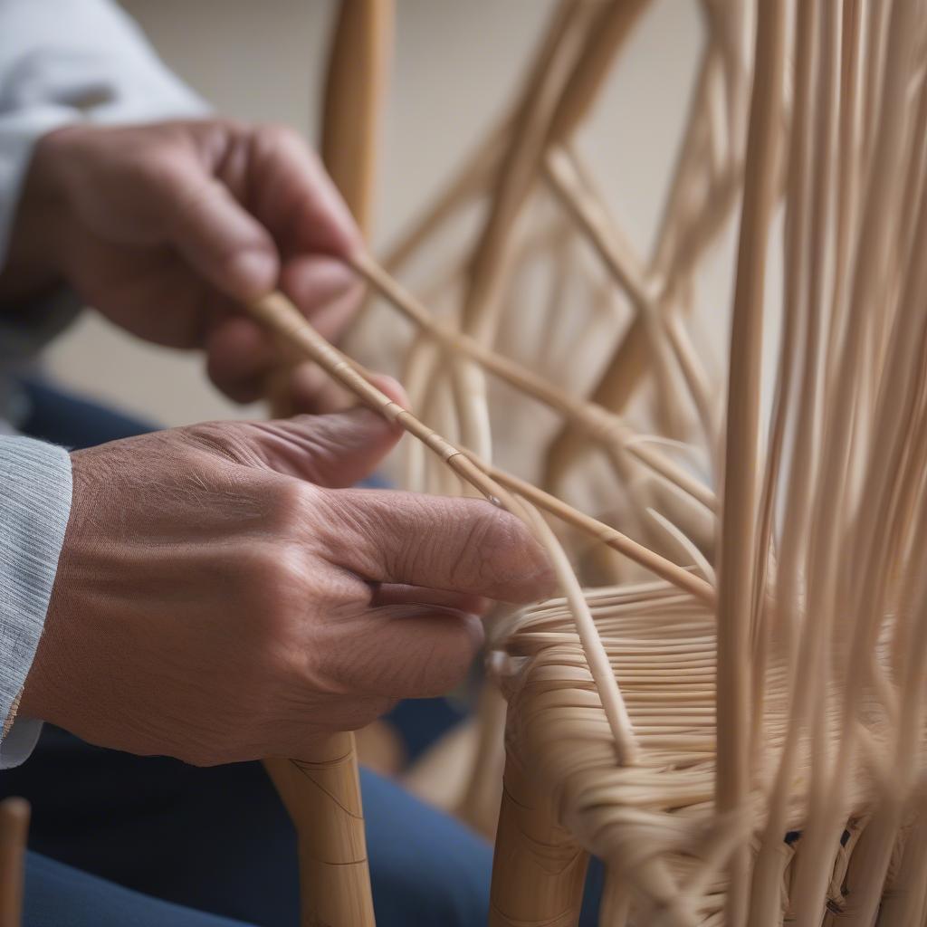 Close-up of chair caning seat weaving, showcasing the intricate handwoven pattern and the natural color of the cane.