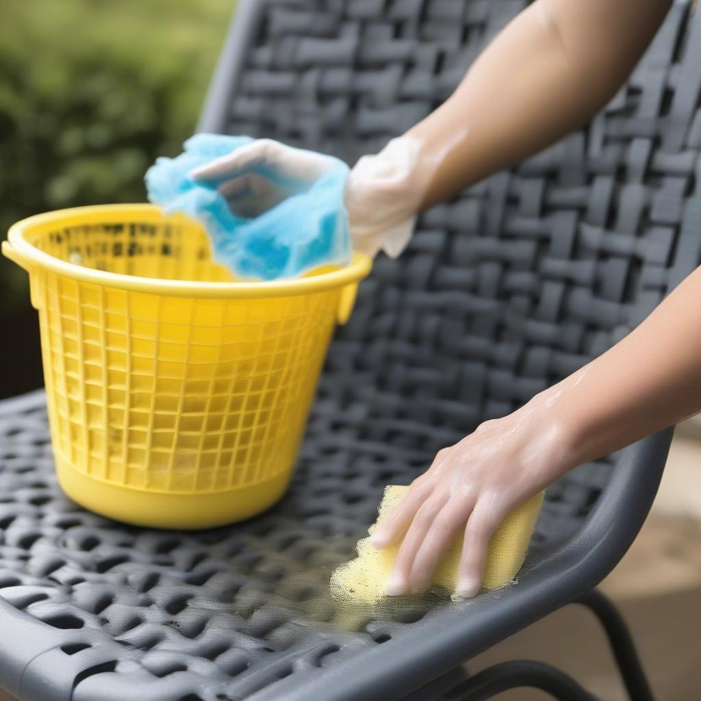 Cleaning an outdoor plastic weave chair with soap and water