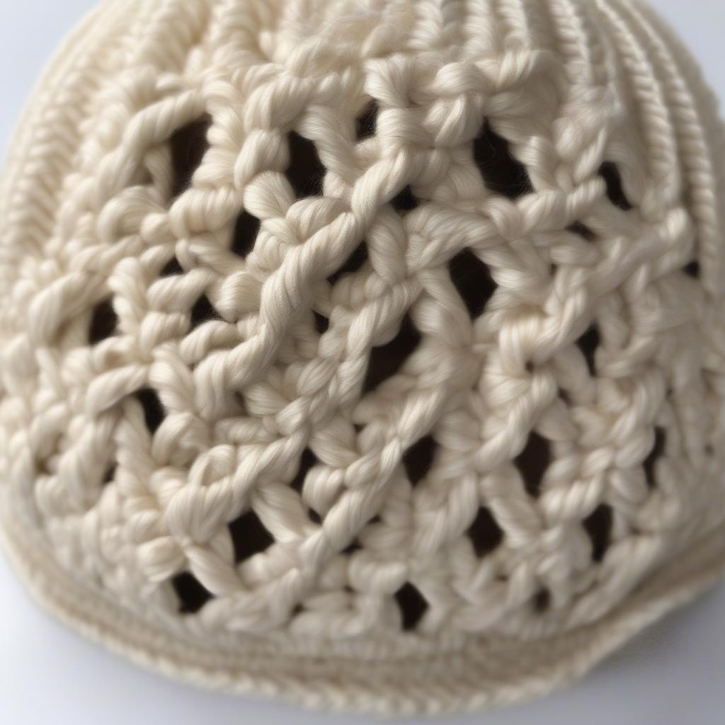 Close-up of a Crochet Basket Weave Messy Bun Hat