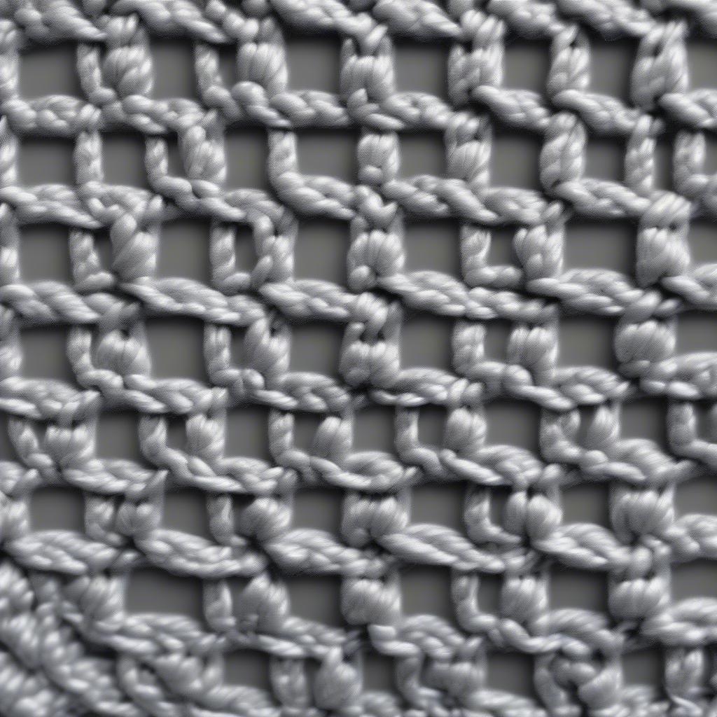 Close-up view of the crochet basket weave stitch, showcasing its texture and intricate details.