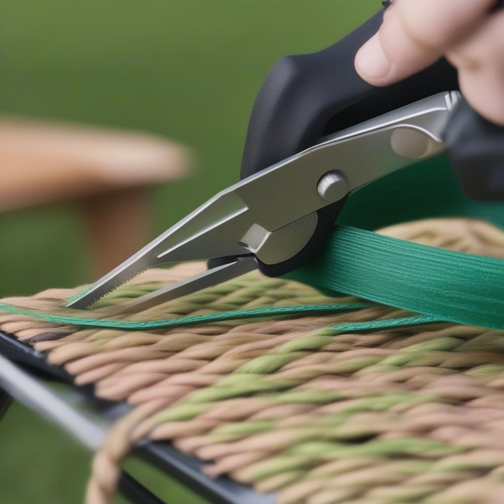 Cutting webbing for a DIY weave pattern on a folding lawn chair