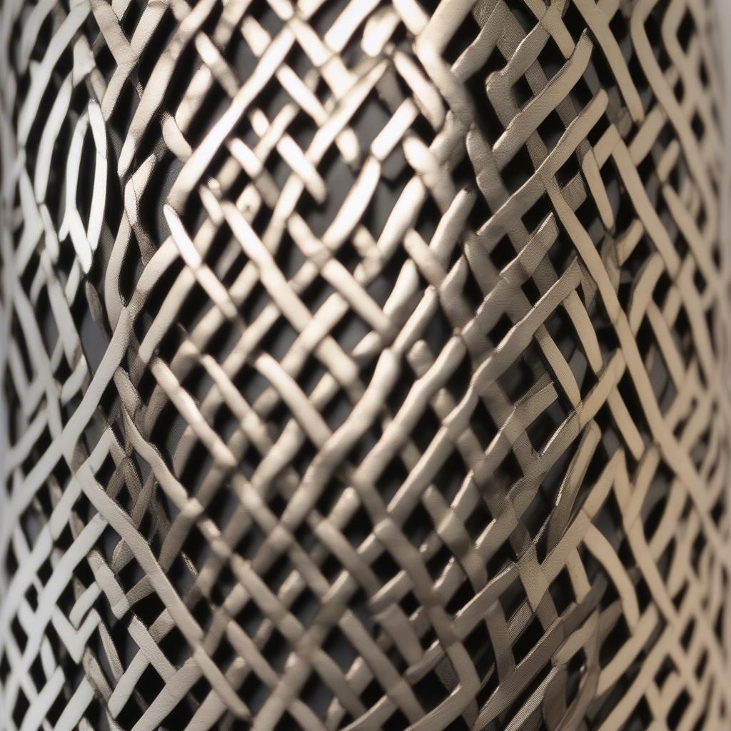 Close-up view of the Fangio Lighting Moroccan Weave Metal Table Lamp showcasing the intricate metalwork and design details.