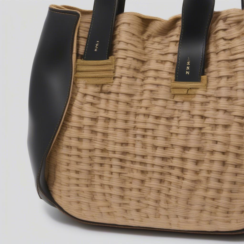 Close-up details of an authentic Marni woven bag highlighting the quality stitching and label.