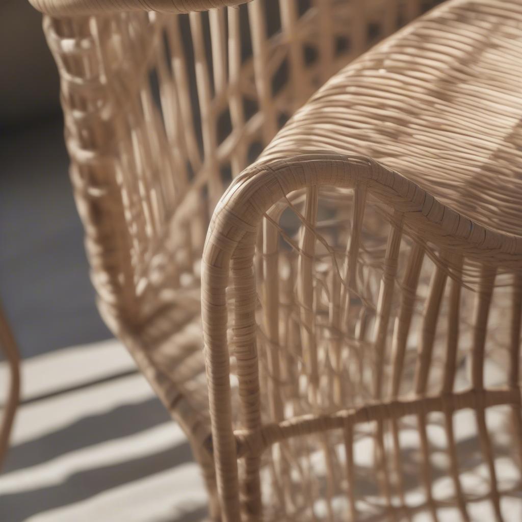 Close-up view of the natural open weave pattern on a Girona outdoor accent chair