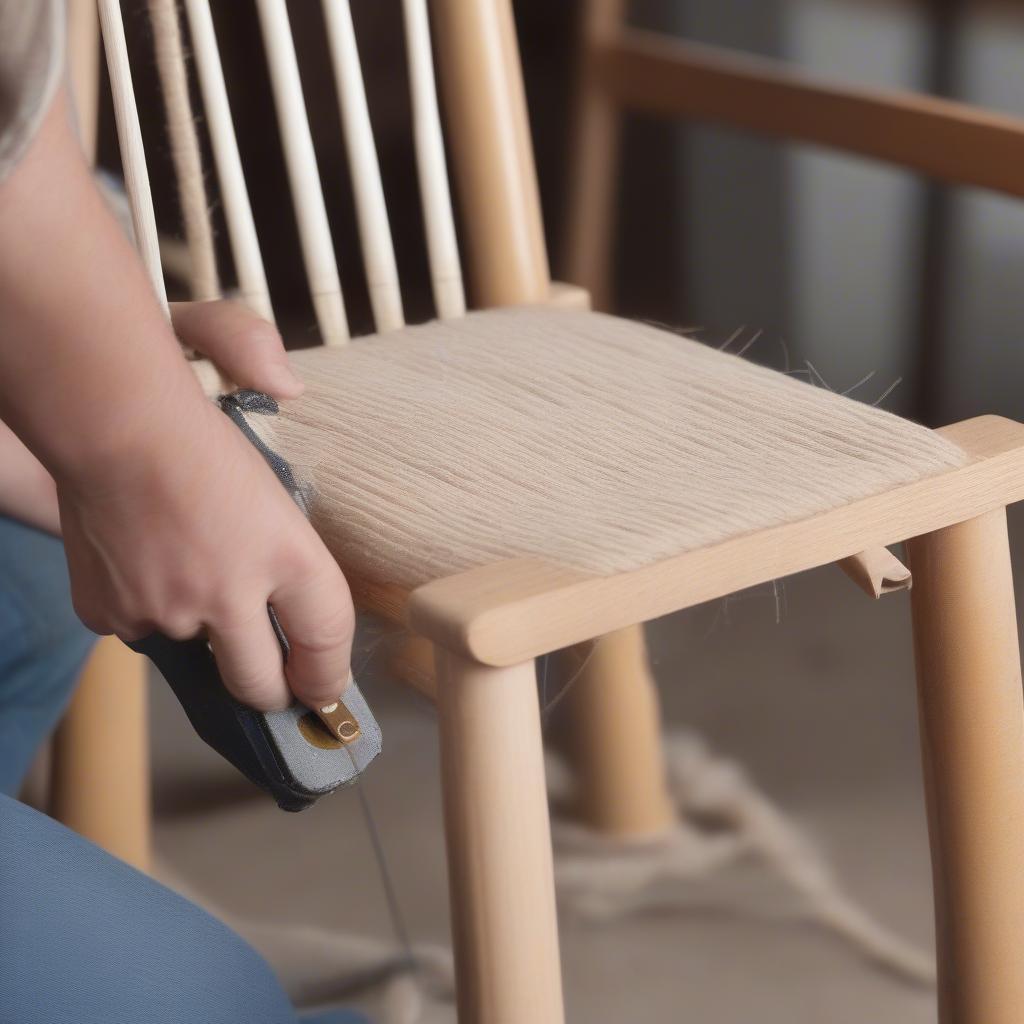 A chair frame being prepared for twine weaving.