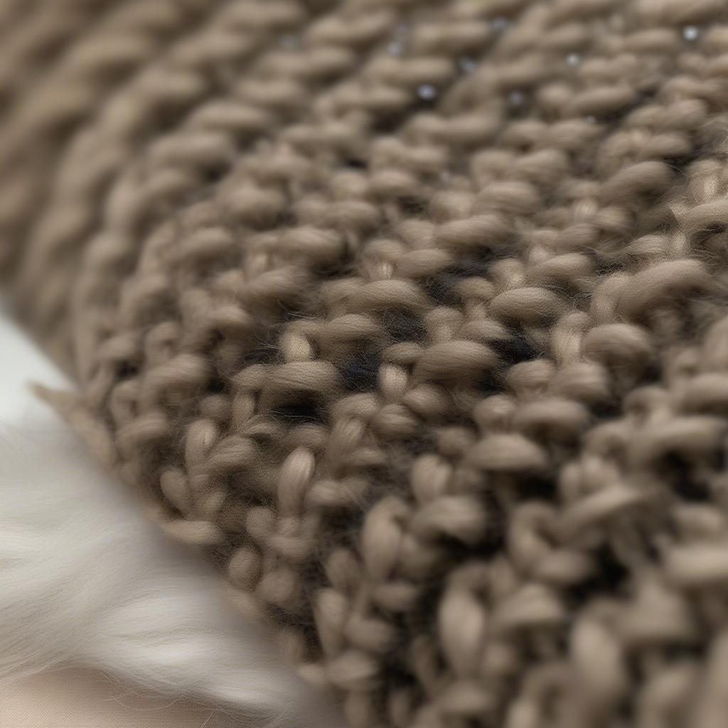 Close-up view of a sherpa basket weave rimjhim hat, showcasing the intricate basket weave pattern and the soft texture of the sherpa fleece lining.