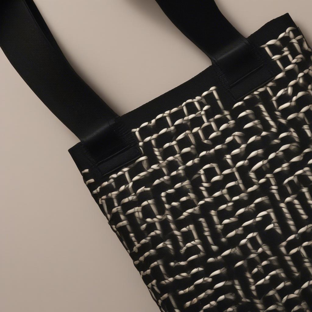 Close-up view of the signature club black weaved straptote bag, showcasing the intricate weave and durable strap.