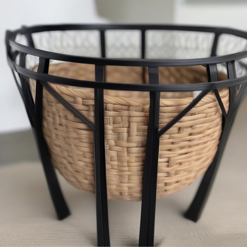 Small Black Metal Accent Table with Basket Weave Trim - Close-up of the intricate basket weave pattern on a black metal accent table, showcasing the craftsmanship and texture.