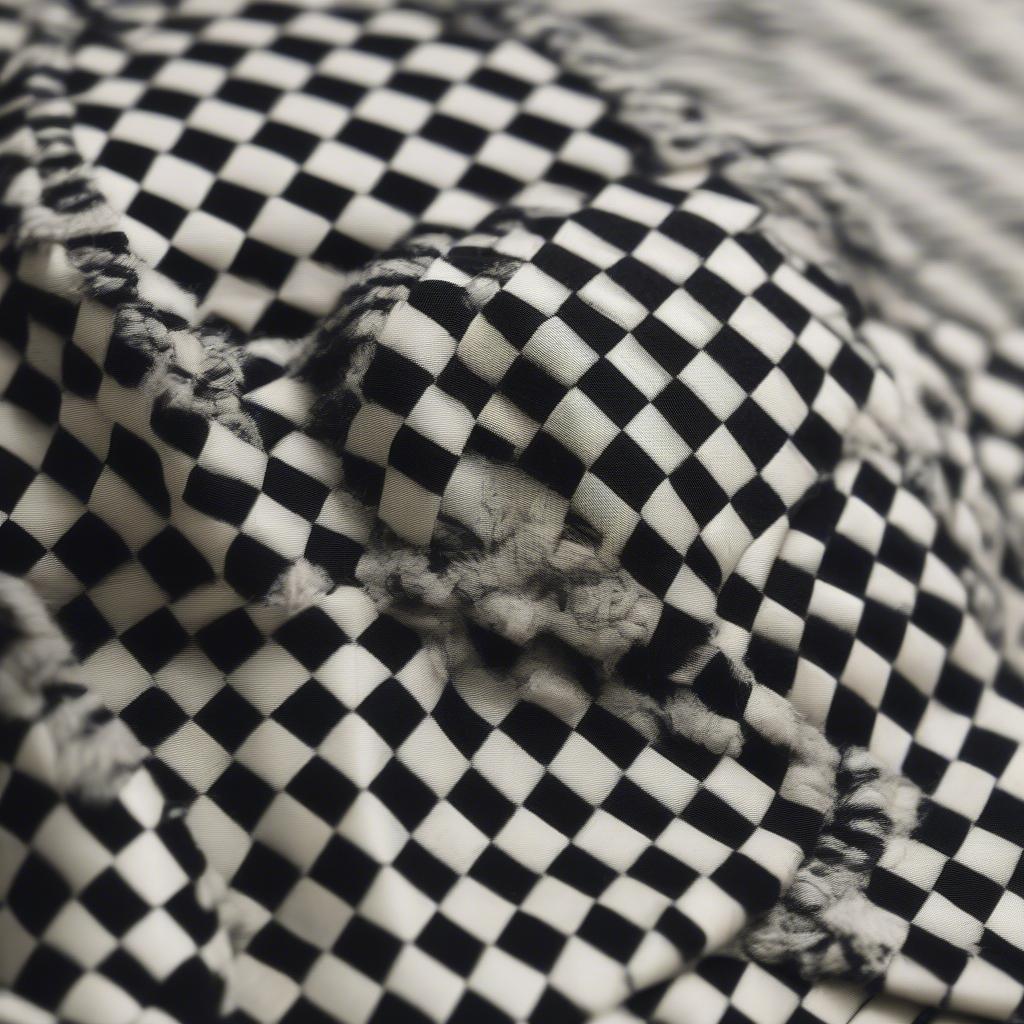 Close-up view of the construction of a supreme checkered weave hat, showcasing the quality of the stitching and materials.