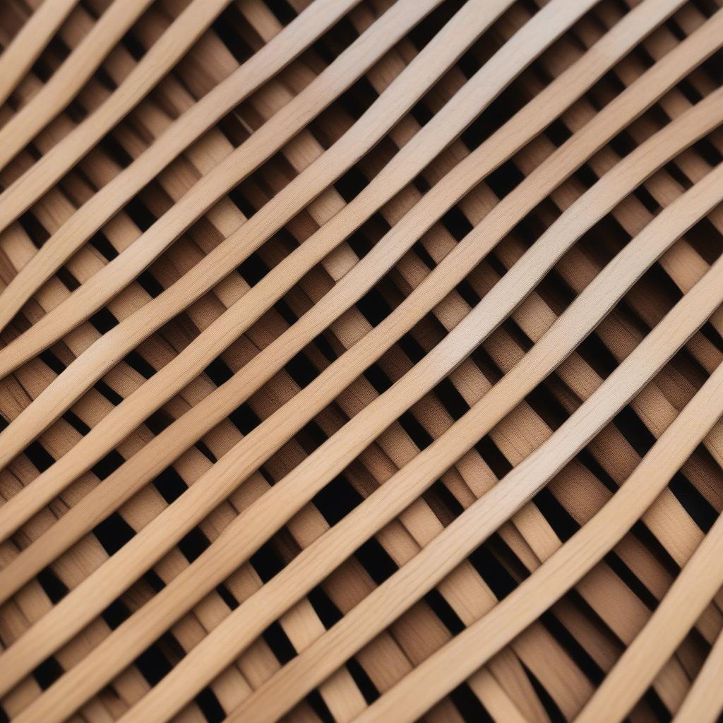 Close-up view of a vertical basket weave fence, showcasing the intricate weaving pattern and the natural texture of the wood.