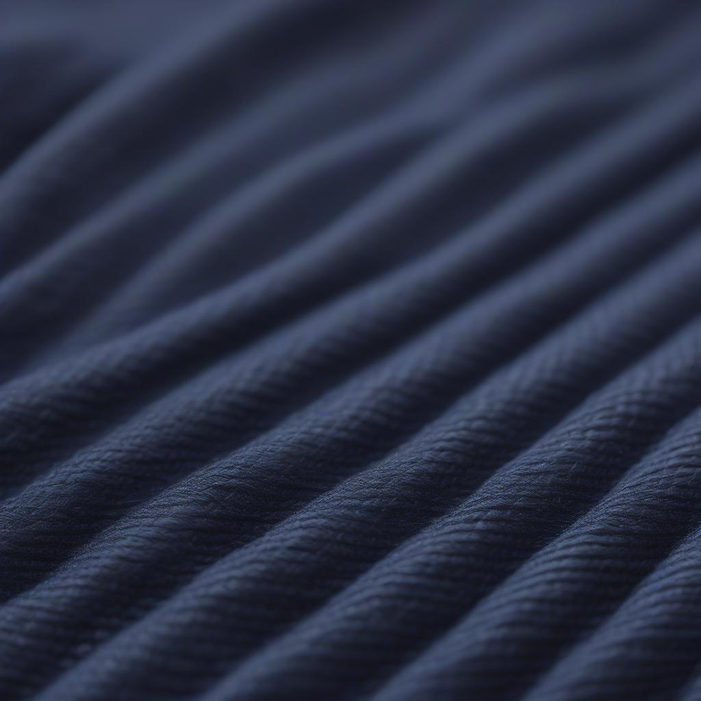 Close-up of the Nordic Weave Indigo fabric on the West Elm Parker Slipper Chair