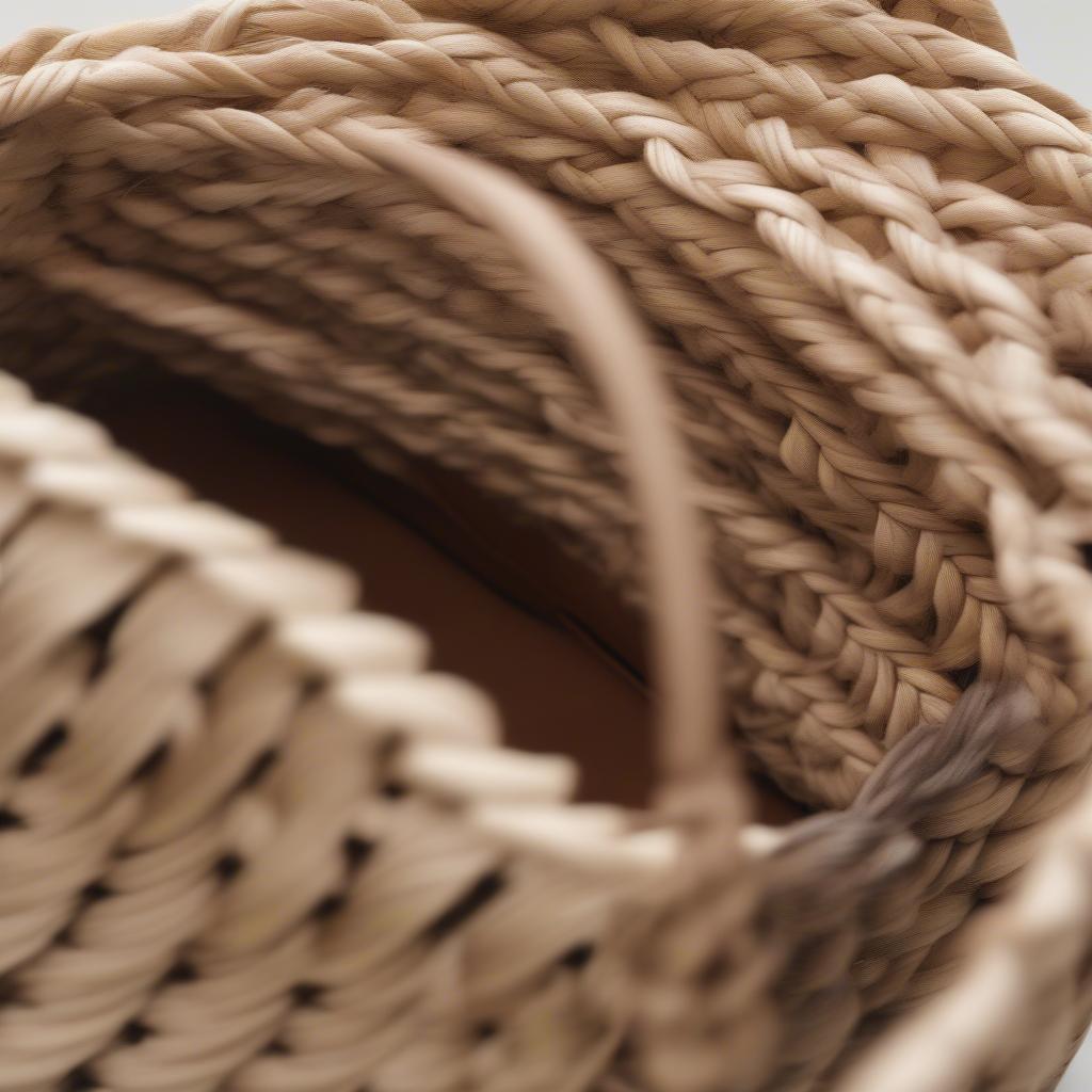 Close-up view of an aje woven bag showcasing the intricate details and craftsmanship