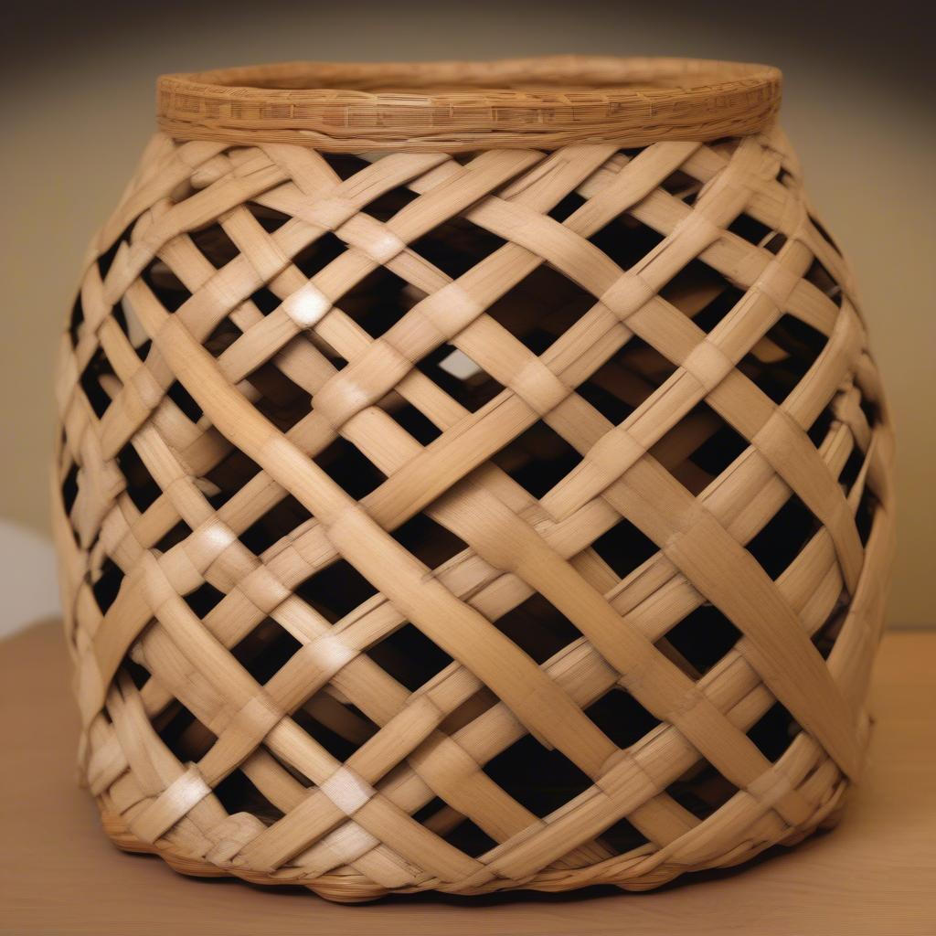 Detailed view of the construction of an antique bamboo basket with diamond pattern weave