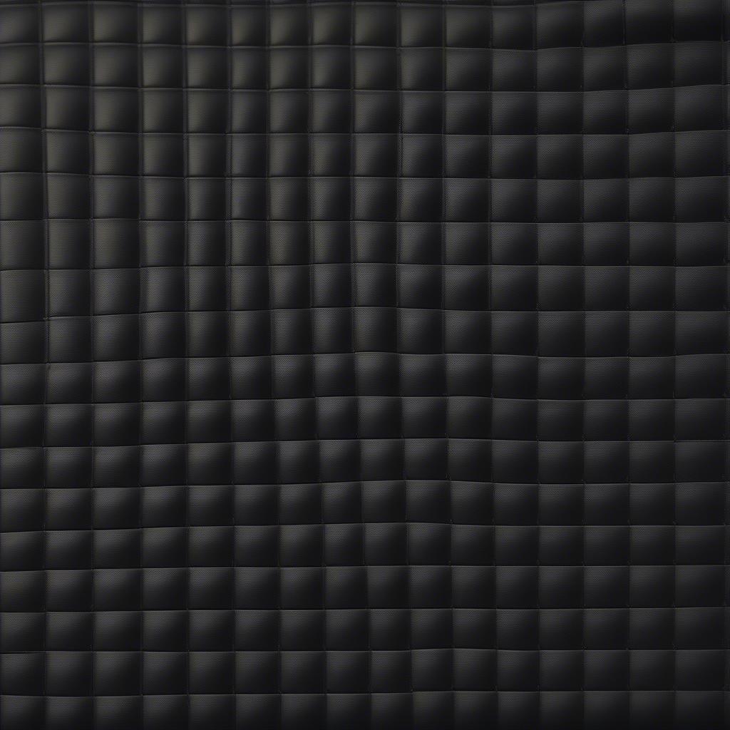 Close-up of auto seat vinyl basket weave fabric showing texture and pattern