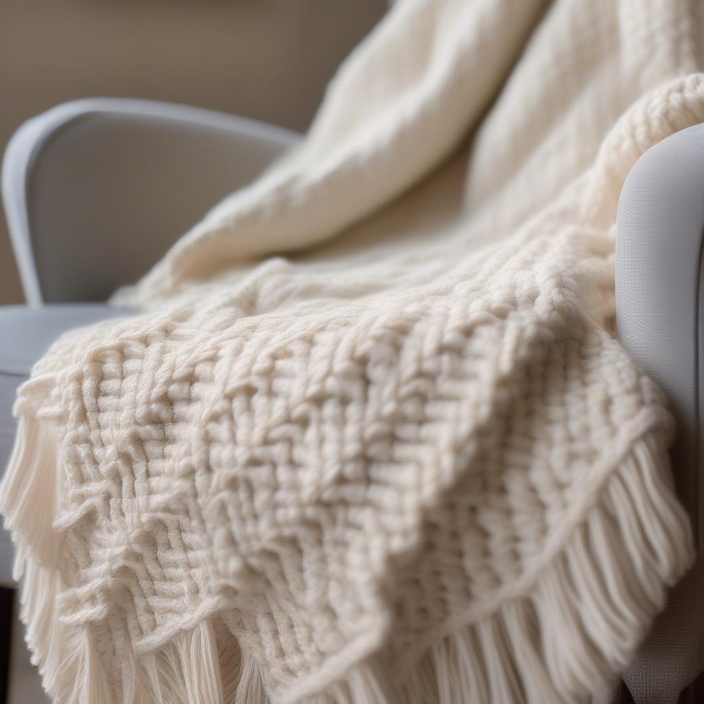 Close-up of a basket weave crochet afghan blanket showing the textured stitch detail