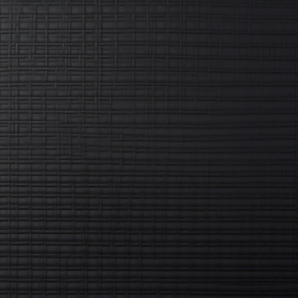 Close-up of a basket weave textured black kydex sheet