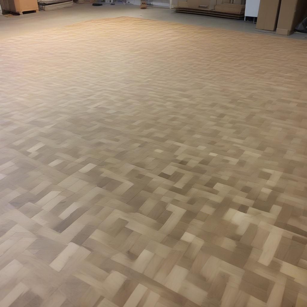 Basket weave dance floor installation showing subfloor and initial panel placement