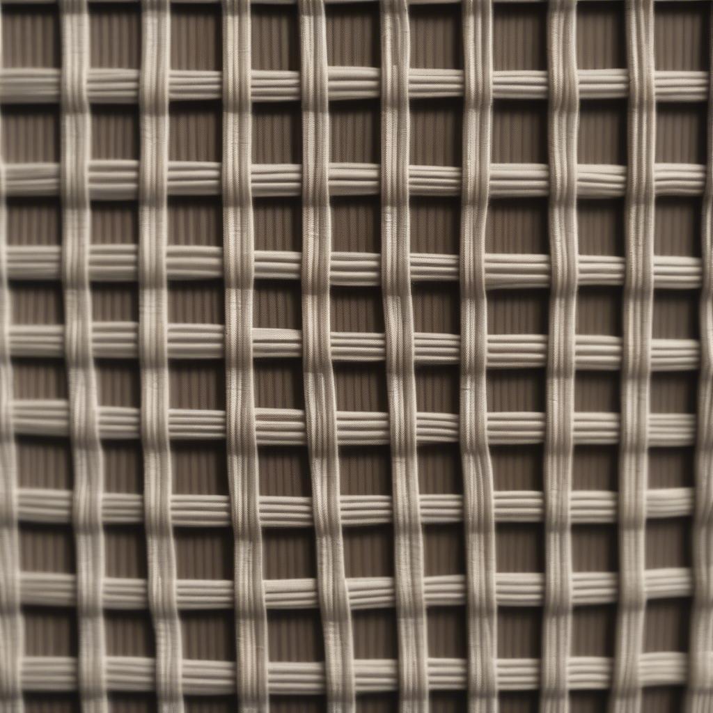 Close-up view of basket weave fabric showing the interlaced threads and textured surface