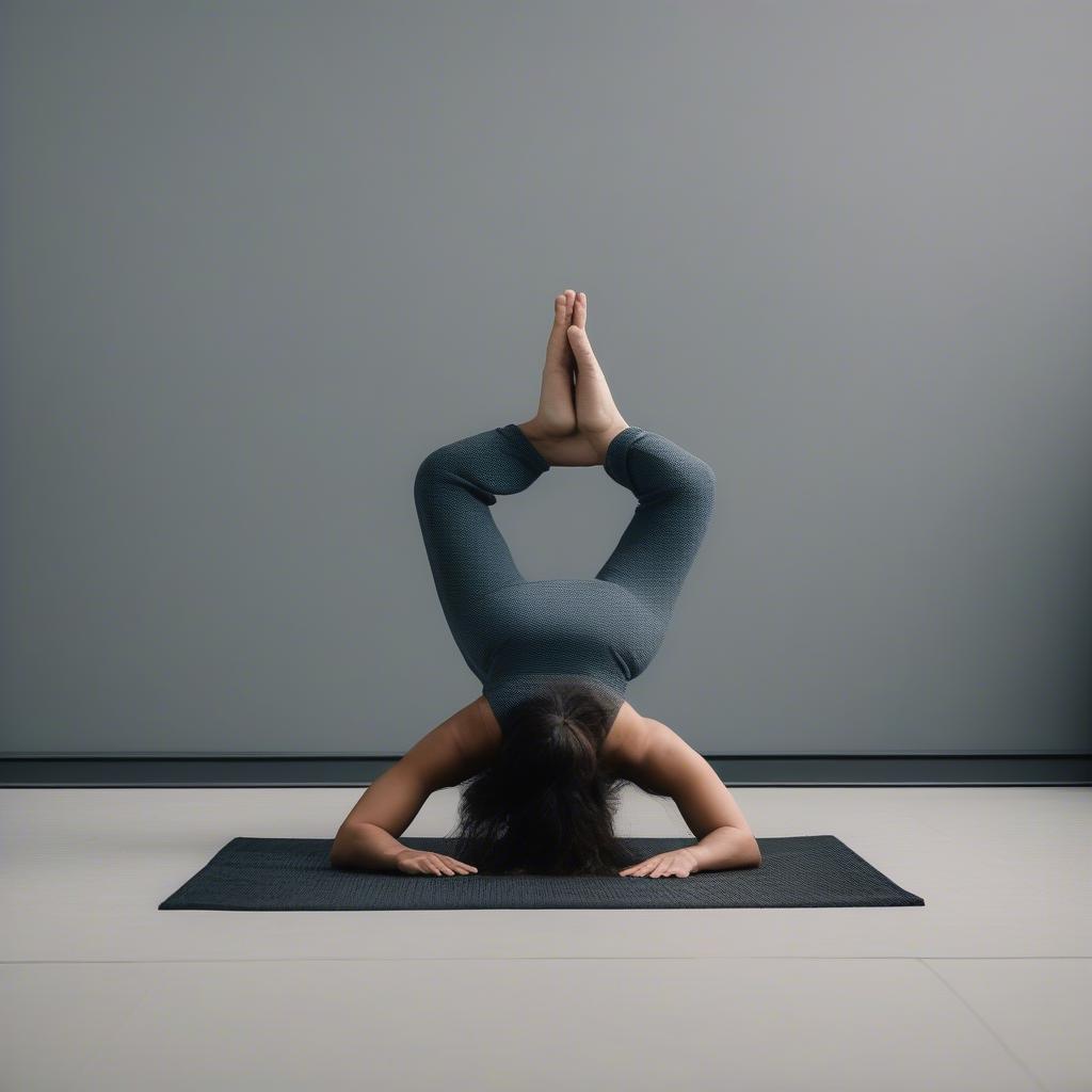 Yogi holding the full basket weave headstand pose