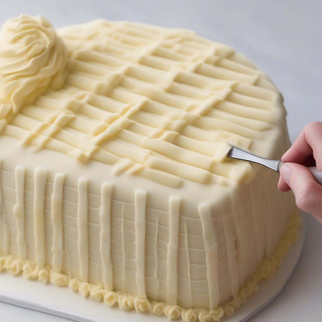 Applying basket weave icing on a cake