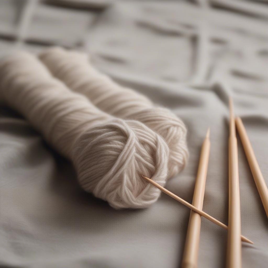 Knitting needles and yarn prepared for a basket weave project