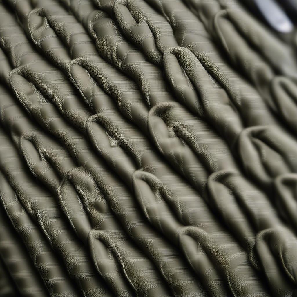 Close-up view of a basket weave MOLLE pouch, highlighting the intricate weaving pattern and durable material.