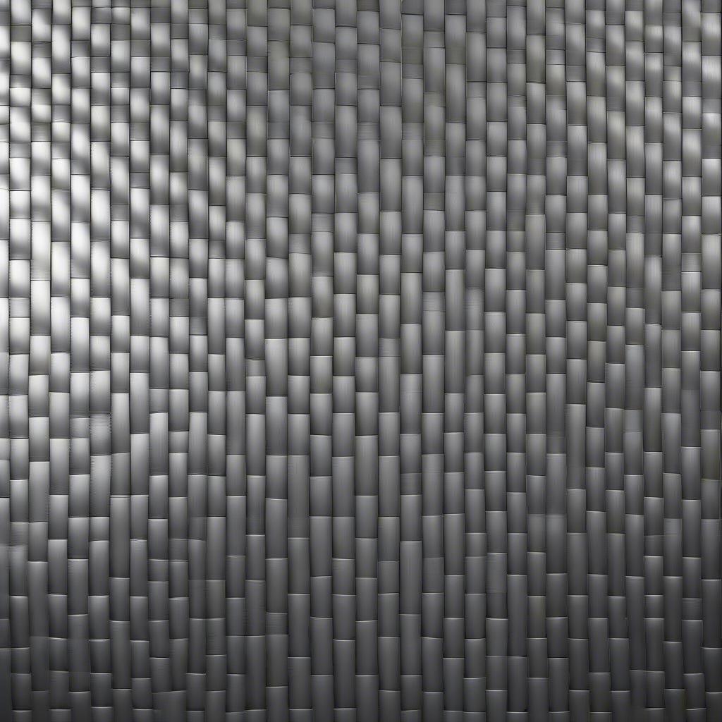 Close-up view of the basket weave texture on stainless steel, showing the intricate woven pattern.