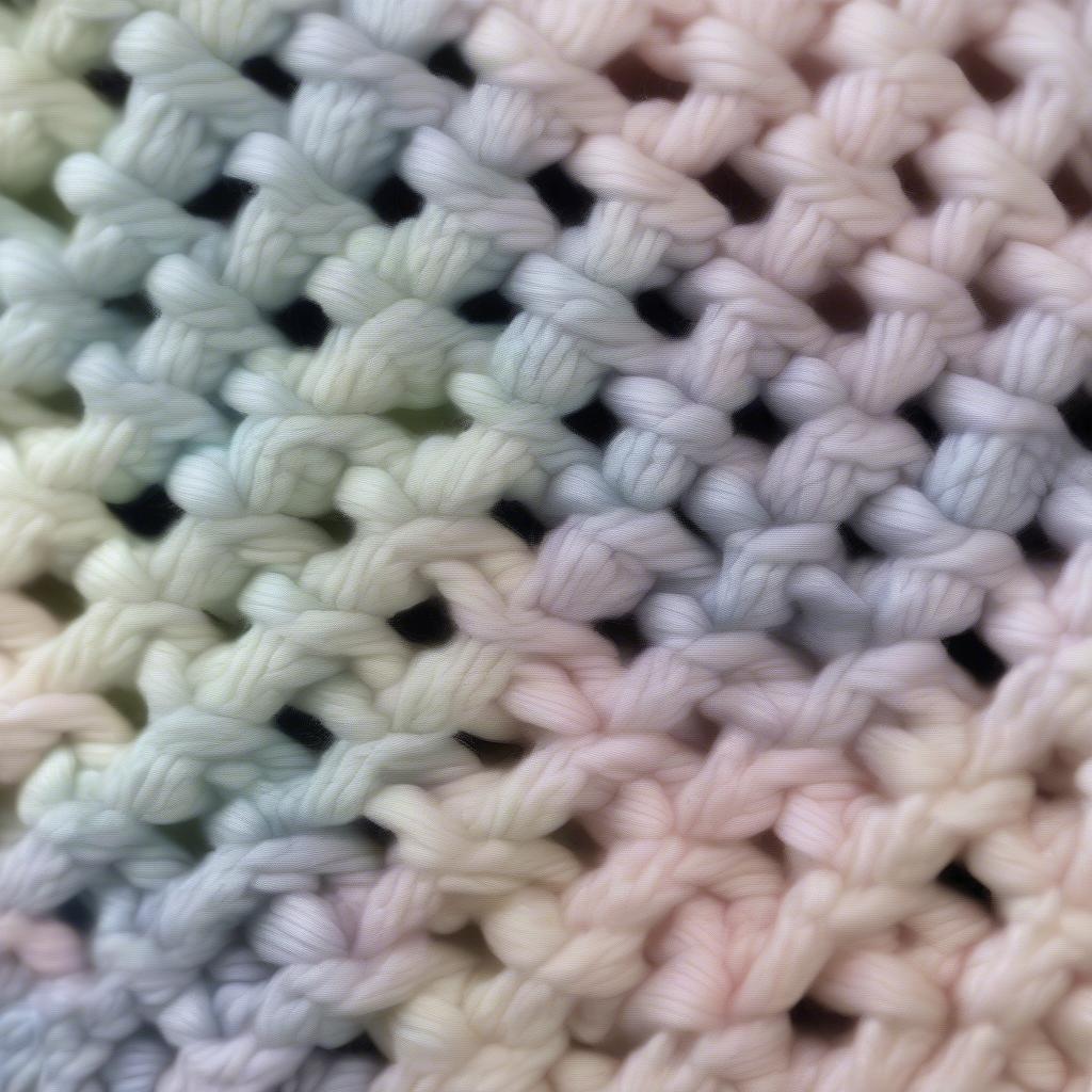 Close-up view of the basket weave stitch on a baby beanie.