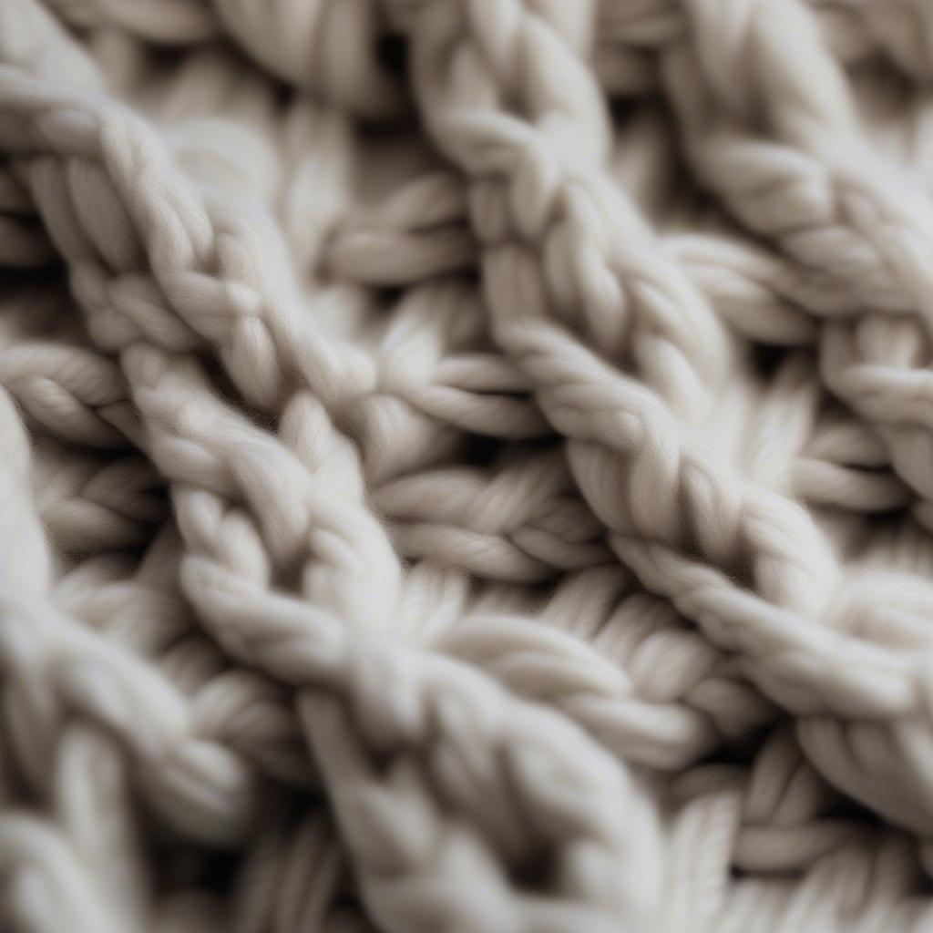 Close-up view of the basket weave stitch on a chunky knit blanket