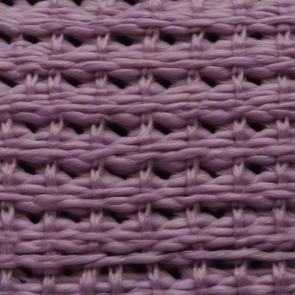 Close-up view of the basket weave stitch in embroidery