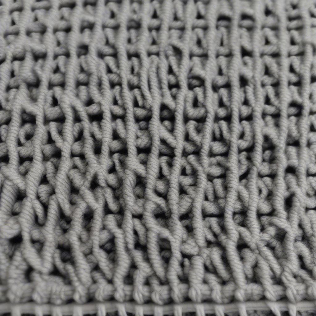 Close-up of a basket weave treble crochet blanket, showcasing the intricate texture and stitch definition.