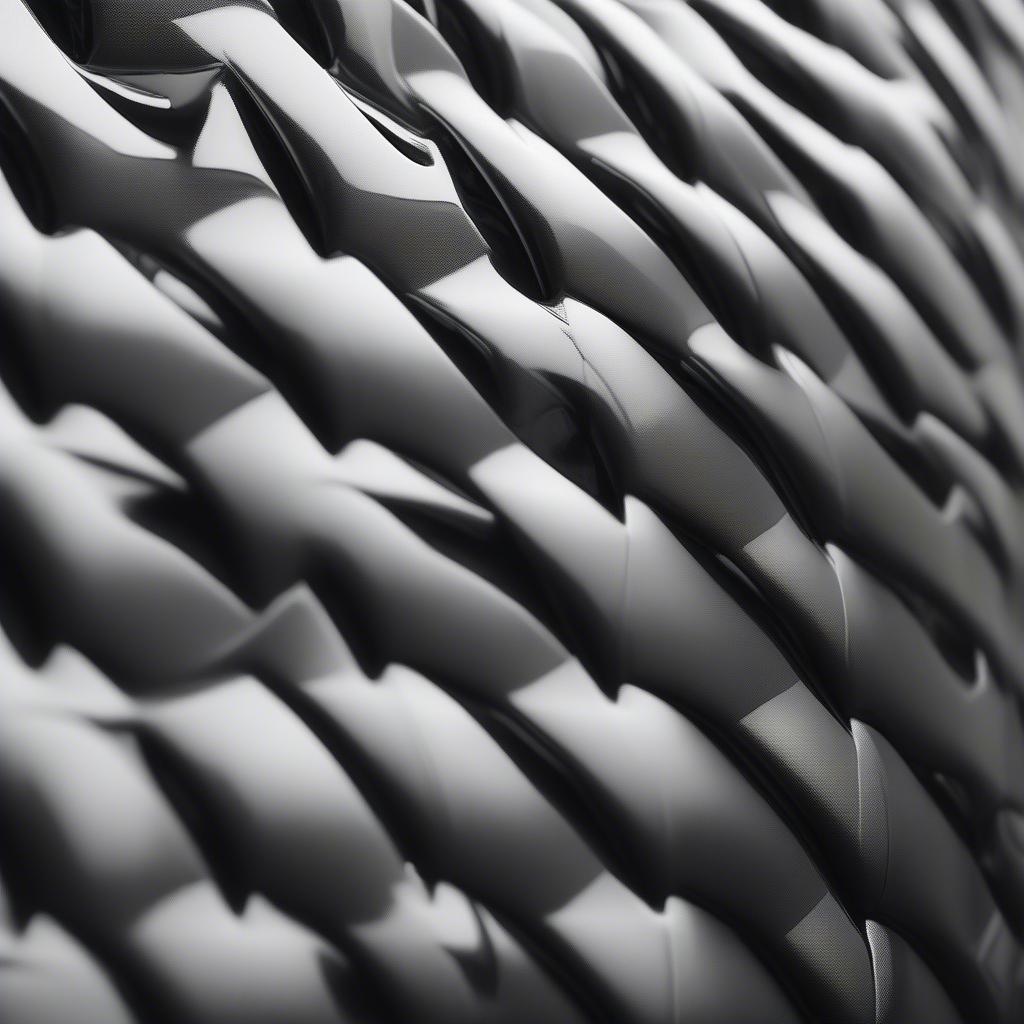 Close-up of a car's exterior trim wrapped in basket weave vinyl