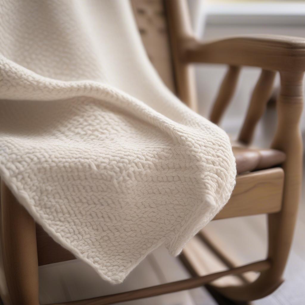 Close-up view of a bella coco basket weave blanket, showcasing the intricate stitch detail and texture.