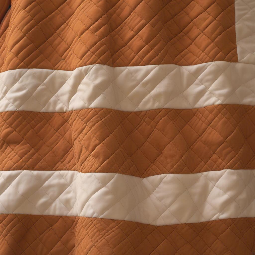 Close-up view of the Bentley Apricot Brandy Basket Weave Quilt showcasing the intricate basket weave pattern and the rich apricot brandy color.