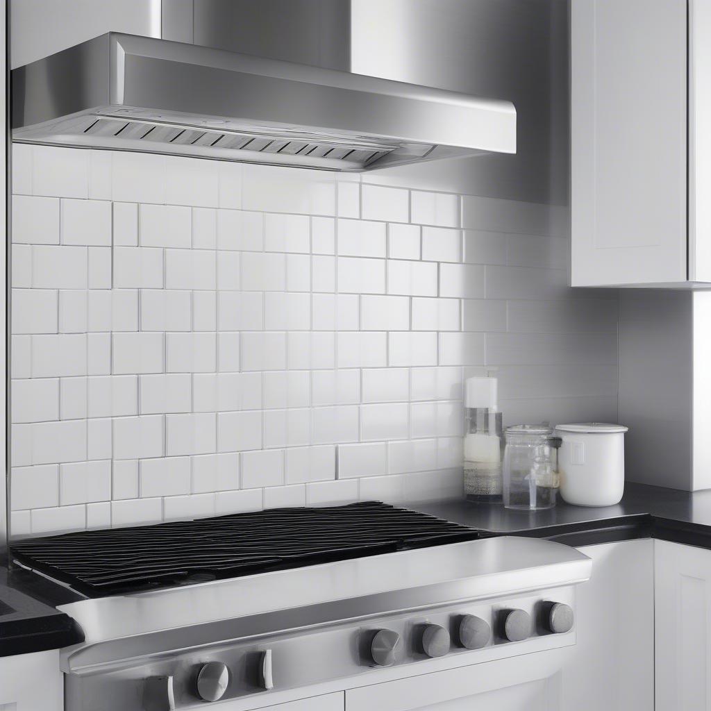 Black and white basket weave tile used as a kitchen backsplash