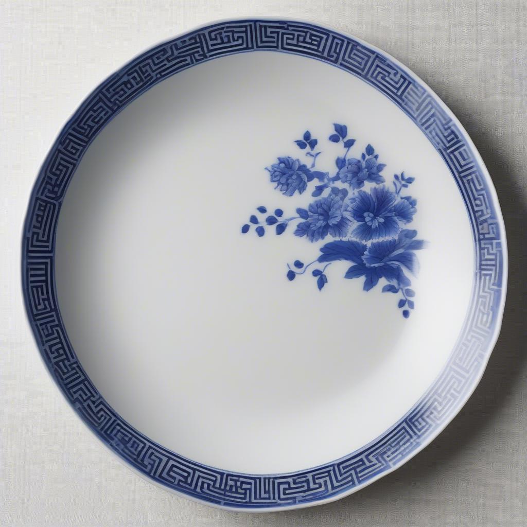 Antique Chinese porcelain plate with blue and white basket weave design