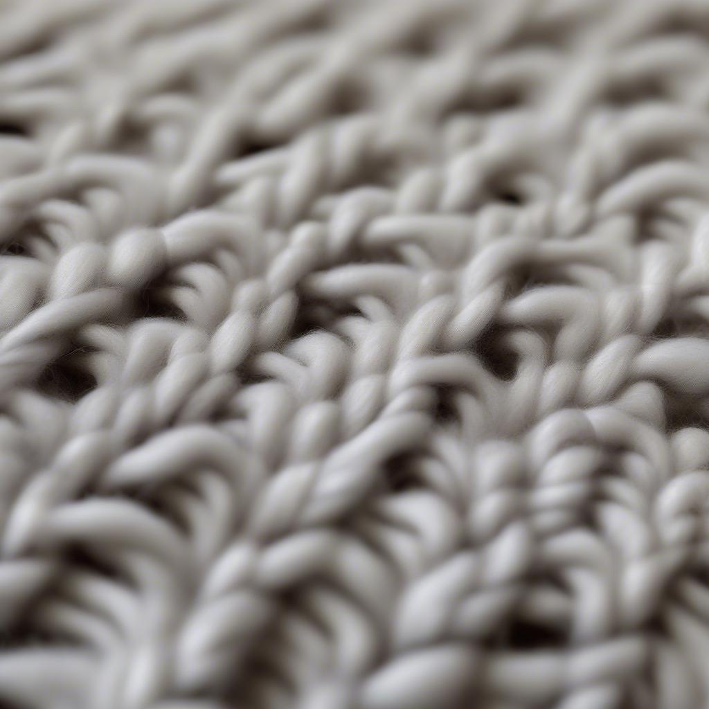 Close-up of a chunky basket weave crochet blanket