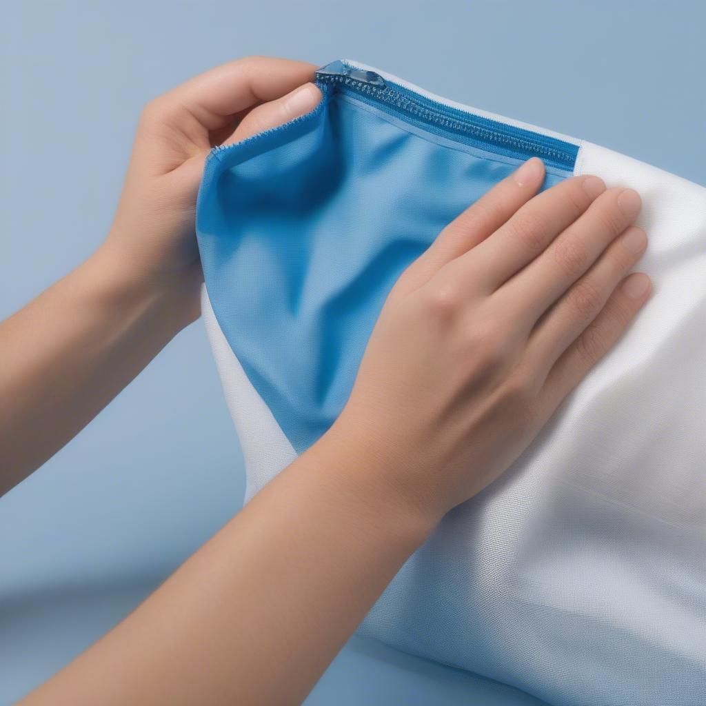 Cleaning a blue PP nov-woven zipper bag with a damp cloth, demonstrating the ease of maintenance.