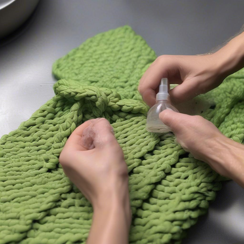 Cleaning a woven paracord shoulder bag with a damp cloth and mild soap.