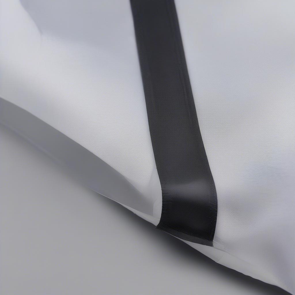 Close-up view of the W cut on a non-woven bag, showing the precise cut and finished edges.