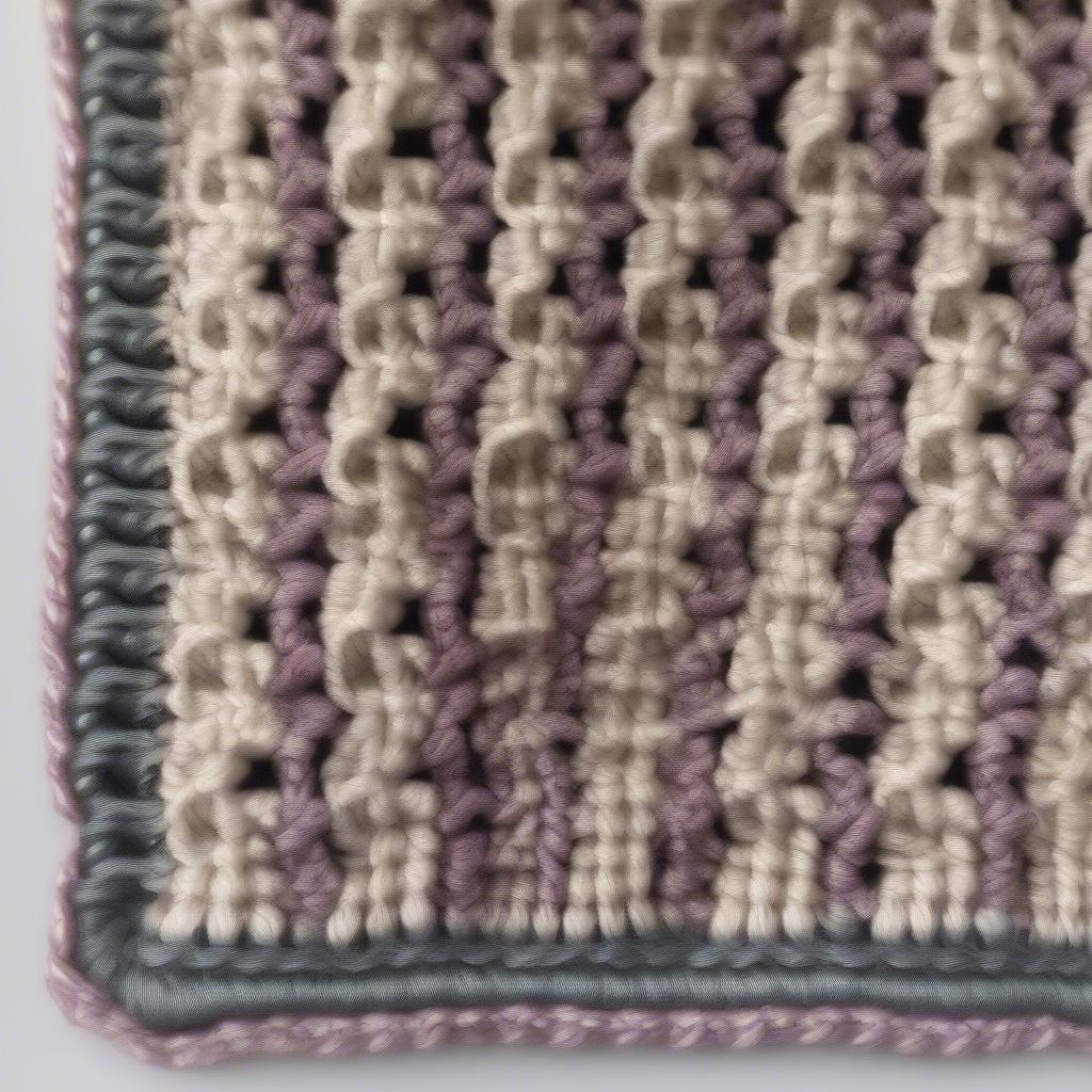 Crochet basket weave baby blanket with a decorative border