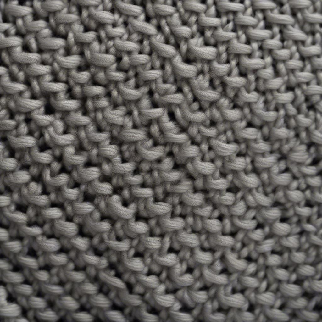 A stylish sweater featuring the diagonal basket weave stitch, demonstrating its application in garment design.