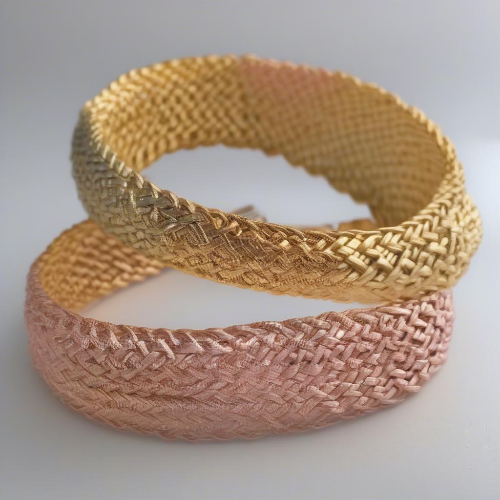 Various gold basket weave bracelets showcasing different gold karats and colors, including yellow gold, white gold, and rose gold.