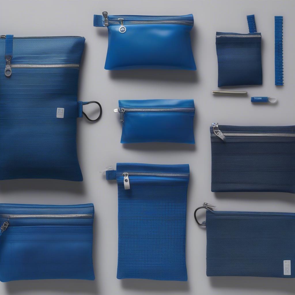 Various sizes of blue PP nov-woven zipper bags displayed together, showcasing size options available.