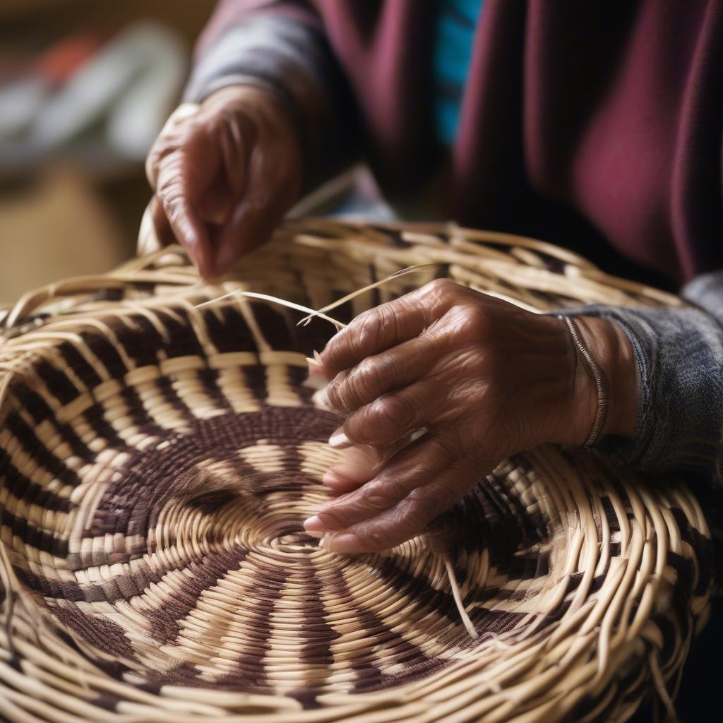 Dotsul Ali meticulously weaving a traditional Washoe basket, using willow and other natural materials. Her hands expertly manipulate the fibers, creating intricate patterns and designs.