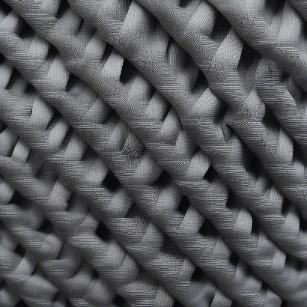 Close-up view of durango grey basket weave fabric showing the intricate texture and subtle color variations