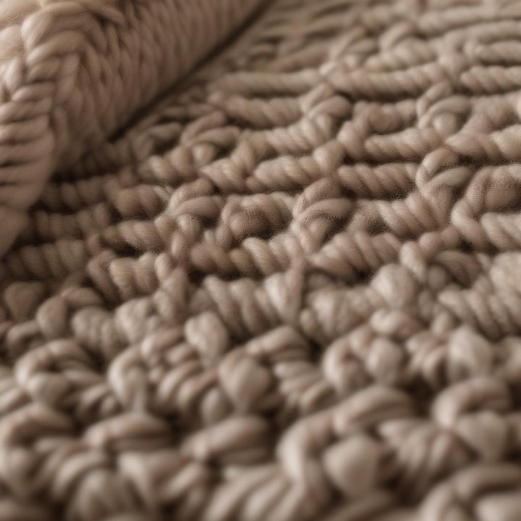 Close-up of an easy basket weave afghan pattern, showcasing the textured stitch detail and cozy yarn.