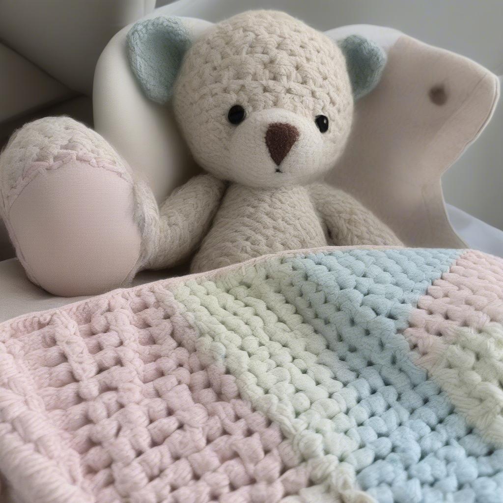 A completed basket weave baby blanket showcasing personalized details like an embroidered name or crocheted appliqués.